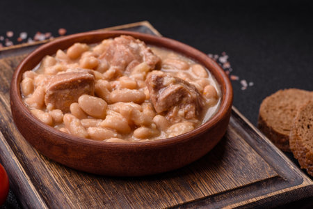 Cassoulet with white beans, meat and sausages, vegetables, salt and spices as a classic French foodの写真素材