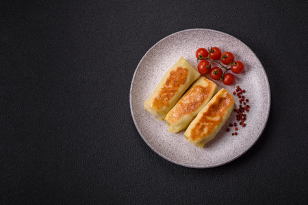 Sweet or savory crepe with different fillings for a hearty breakfast on a dark concrete backgroundの写真素材