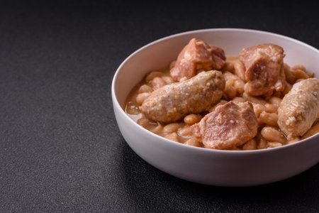 Cassoulet with white beans, meat and sausages, vegetables, salt and spices as a classic French foodの写真素材