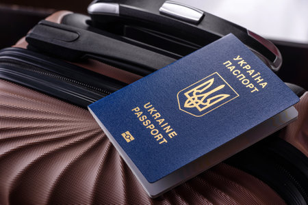 International passport on a suitcase, departure from the airport, international travelの写真素材