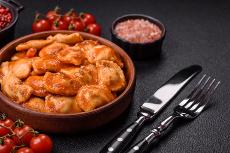 Ravioli with meat or vegetarian with ricotta, salt and spices in a ceramic plateの写真素材