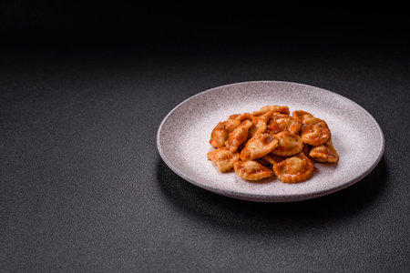 Ravioli with meat or vegetarian with ricotta, salt and spices in a ceramic plateの写真素材