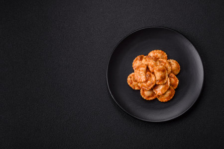 Ravioli with meat or vegetarian with ricotta, salt and spices in a plateの写真素材