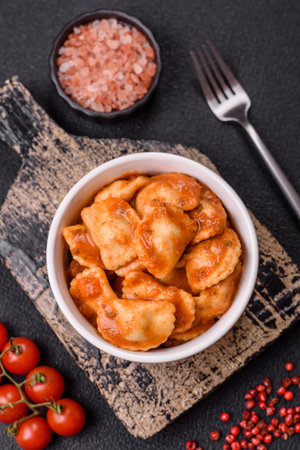 Ravioli with meat or vegetarian with ricotta, salt and spices in a ceramic plateの写真素材