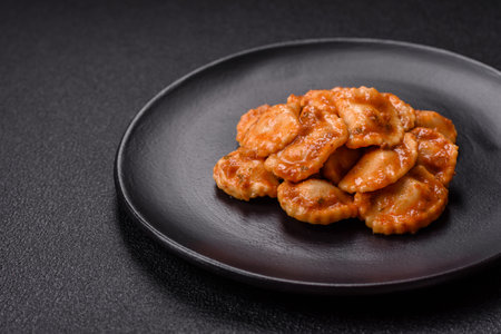 Ravioli with meat or vegetarian with ricotta, salt and spices in a ceramic plateの写真素材