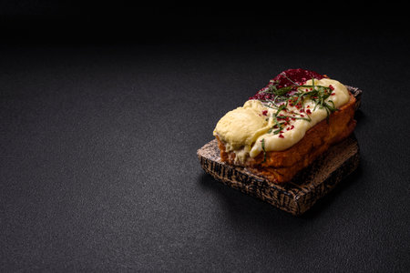 Delicious sweet brioche sandwich with raspberry jam and ricotta cream on a dark concrete background