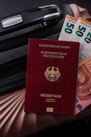 International passport on a suitcase, departure from the airport, international travelの写真素材