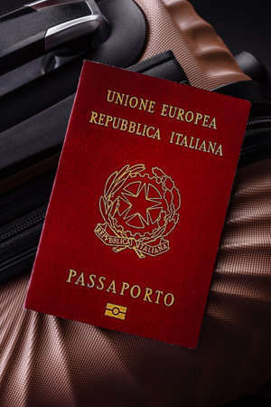 International passport of a citizen of Italy on a suitcase, departure from the airport, international travelの写真素材