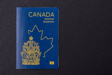 International passport of a citizen of Canada on a dark concrete background, international travelの写真素材