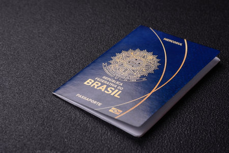 International passport of a citizen of Brazil on a dark concrete background, international travelの写真素材