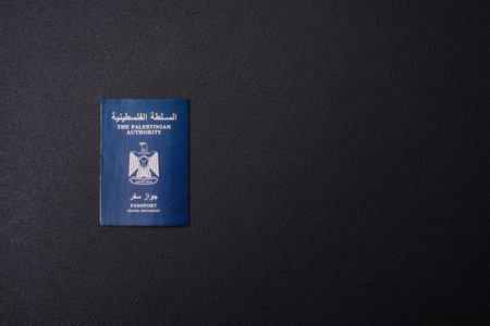 International passport of a citizen Palestine on a dark concrete background, international travelの写真素材