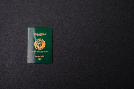 International passport of a citizen Nigeria on a dark concrete background, international travelの写真素材