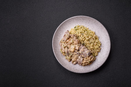 Bowl of food with bulgur, tomatoes, zucchini and sauce. Vegan dishの写真素材