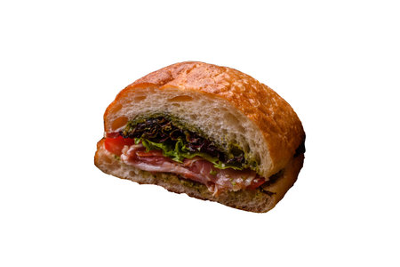 Ciabata with jamon or prosciutto, tomatoes, cheese and lettuce with salt, spices and herbsの写真素材