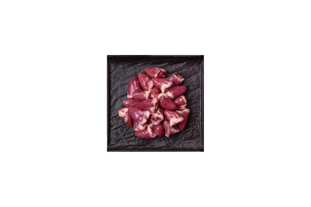 Raw chicken hearts with salt, spices and herbs
