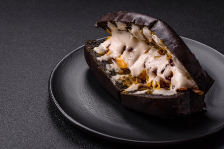 Sandwich with brioche bun, roast beef, stracciatello and vitello tonato sauceの写真素材