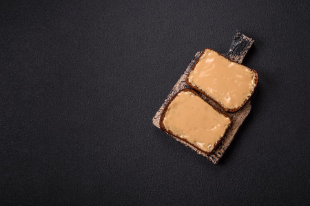 Sandwiches with toast bread, peanut butter and raspberry or strawberry jam. Hearty, nutritious breakfastの写真素材