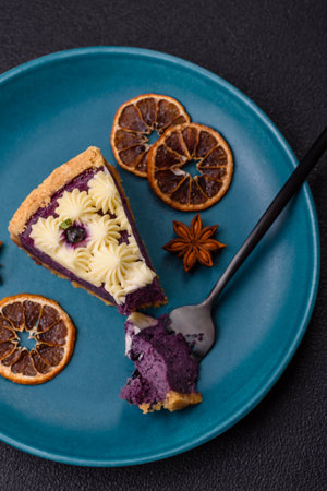 No baked sweet blueberry cheesecake with cream cheese on a dark texture background