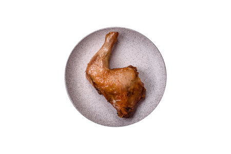Delicious grilled chicken leg or quarter with salt and spices on a white backgroundの写真素材