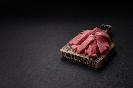 Juicy beef cut into slices on a dark backgroundの写真素材