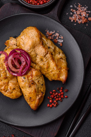 Chicken fillet pieces marinated with salt, spices and herbs and grilledの写真素材