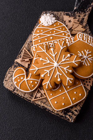 Homemade Christmas gingerbread cookies made as sweets and holiday table decorations