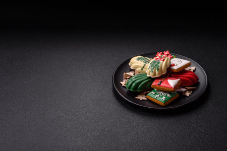 Sweet madeleine sponge cookies covered with colored chocolate in a Christmas style