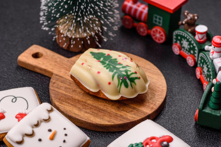 Sweet madeleine sponge cookies covered with colored chocolate in a Christmas styleの写真素材