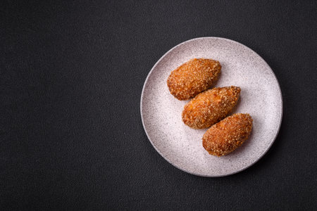 Delicious fresh cutlet or meatball Kiev style with filling, spices and herbsの写真素材