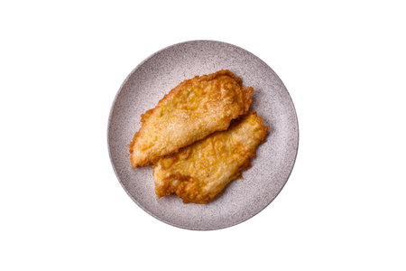 Grilled chicken or turkey chop with salt, spices and herbs on a white backgroundの写真素材