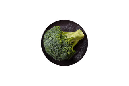 A sprig of raw green broccoli as an ingredient for a healthy vegetarian or vegan meal