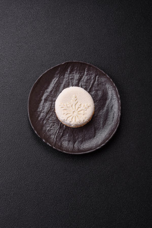 Sweet round tart with berry filling, covered with white chocolateの写真素材
