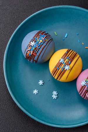 Sweet cocoa bombs with marshmallows and chocolate for making a drink with hot milk