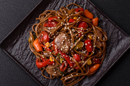 Delicious spicy Asian food soba with buckwheat noodles, beef, vegetables, and spicesの写真素材
