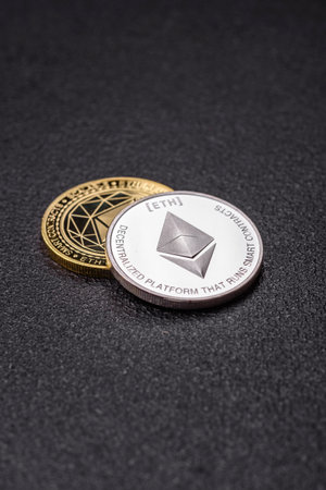 Ethereum cryptocurrency dummy in the form of a round iron coin. Conceptual background for your...