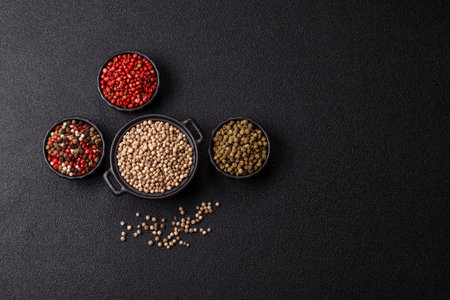 White allspice in a ceramic bowl on a dark concrete backgroundの写真素材