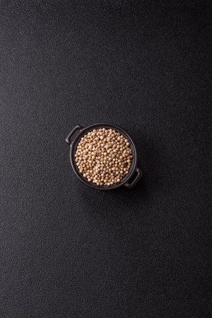 White allspice in a ceramic bowl on a dark concrete backgroundの写真素材