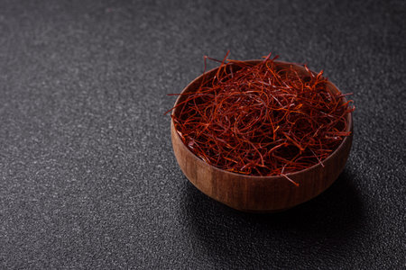 Red thin hot chili threads on a dark background. For decorating Asian dishesの写真素材