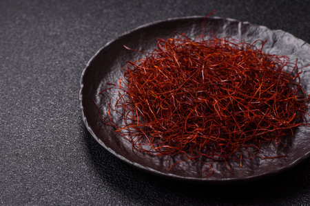Red thin hot chili threads on a dark background. For decorating Asian dishesの写真素材