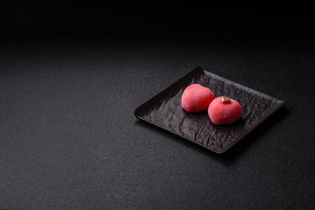 Delicious sweet mochi in the shape of red hearts for the holiday of Valentine's Dayの写真素材