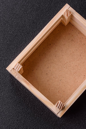 Empty wooden box on dark concrete background