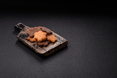 Ginger sweet cookies in brown color on dark backgroundの写真素材