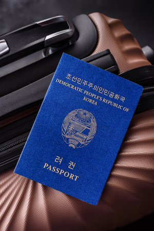 International passport on a suitcase, departure from the airport, international travelの写真素材