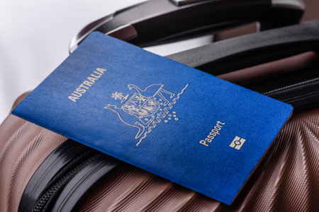 International passport of a citizen of Australia on a suitcase, departure from the airport, international travelの写真素材