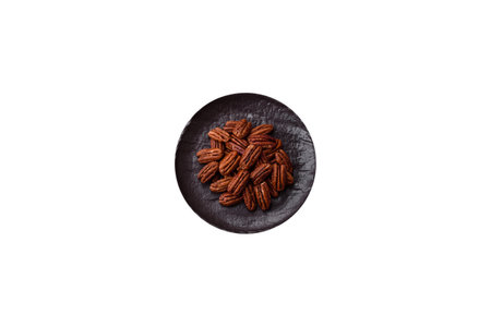 Pecans in a bowl, an ingredient in vegan food. Nuts as a source of nutrients