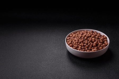 Cereal chocolate corn balls in a bowl. Delicious, healthy breakfast ballsの写真素材
