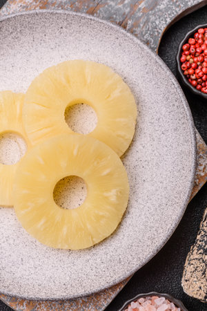 Tropical fruit pineapple in rings or slices tinned sweet yellow colorの写真素材