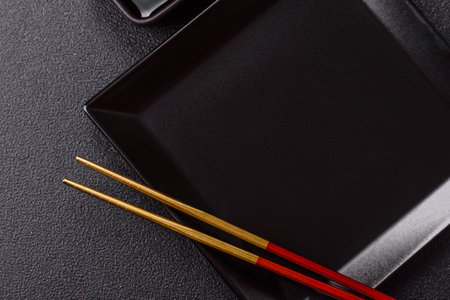 An empty plate with chopsticks for Japanese or Chinese food. Kitchen empty plate for Asian foodの写真素材