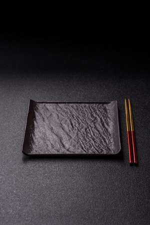 An empty plate with chopsticks for Japanese or Chinese food. Kitchen empty plate for Asian food
