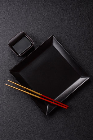 An empty plate with chopsticks for Japanese or Chinese food. Kitchen empty plate for Asian foodの写真素材